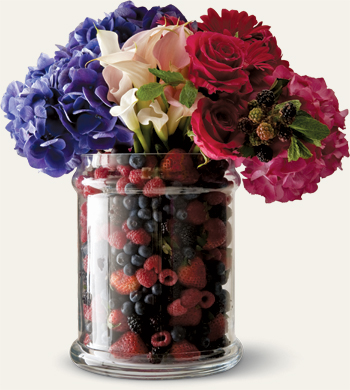 Flowers in vase with berries